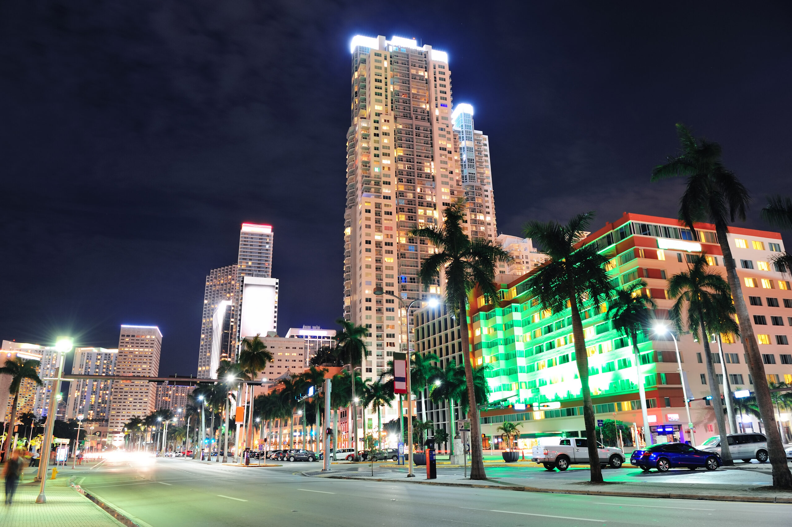 Miami downtown street view at night with hotels.